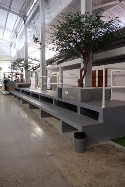 Tribune seating and lounge overlooking the courts
